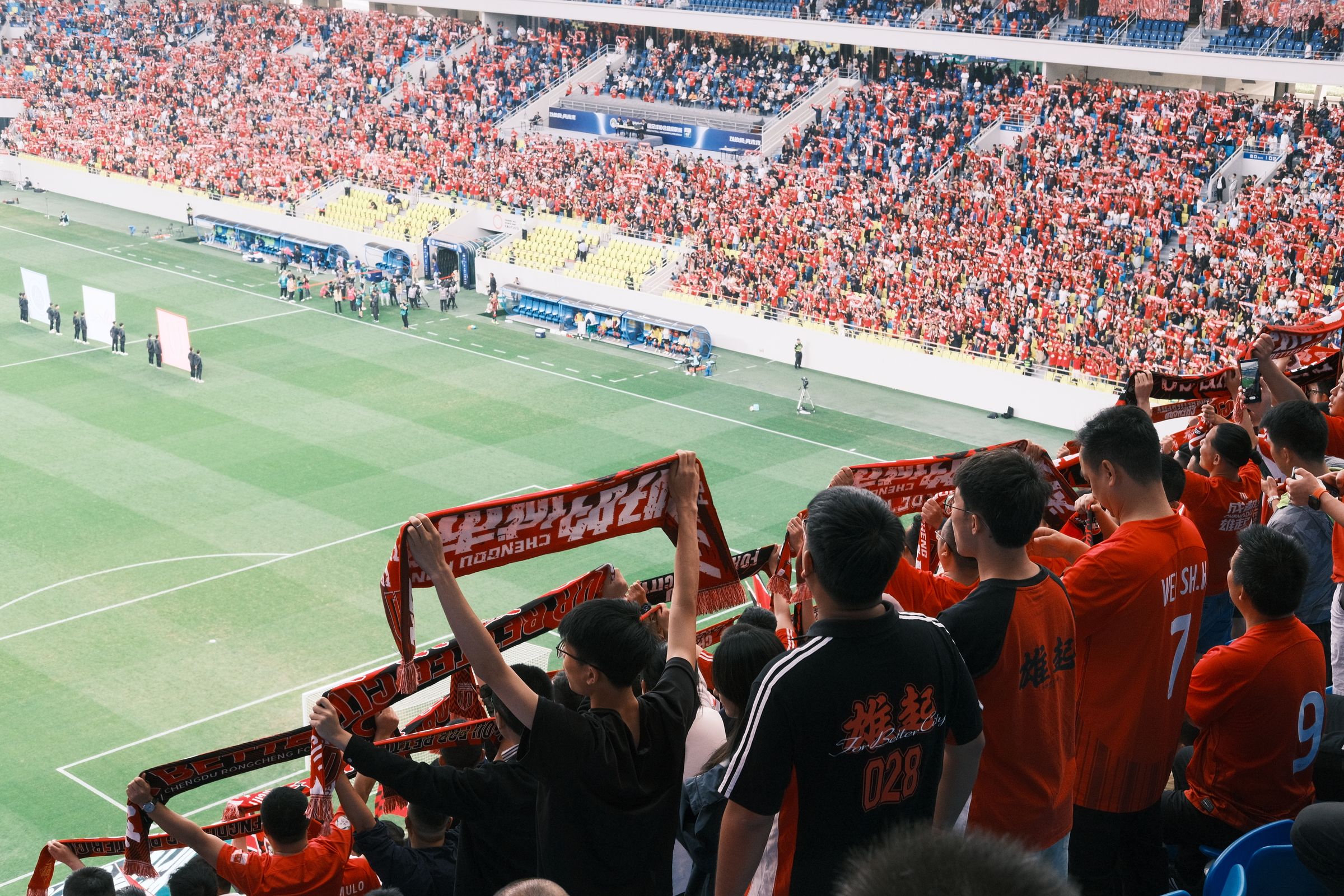 Football supporters watching a match from the stands